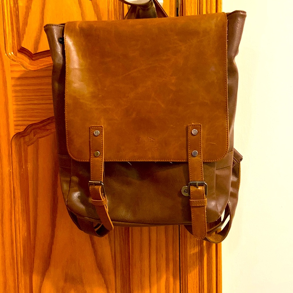 Tan envelope- style laptop backpack.